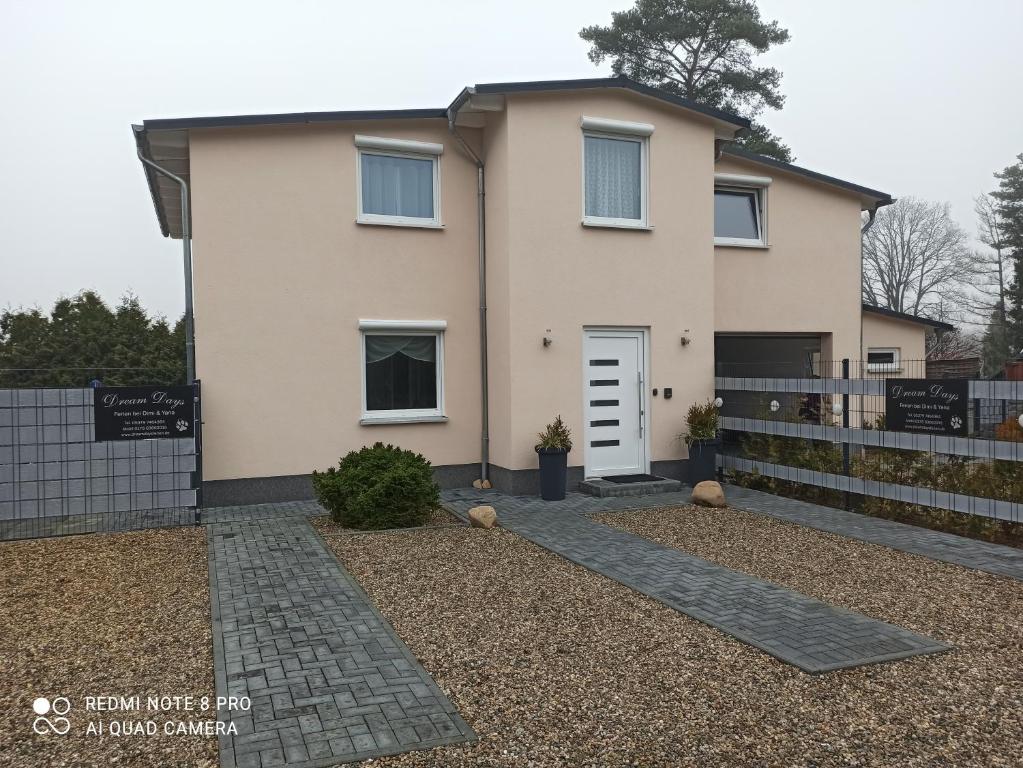a house with a fence in front of it at Dream Days , House in Stüde