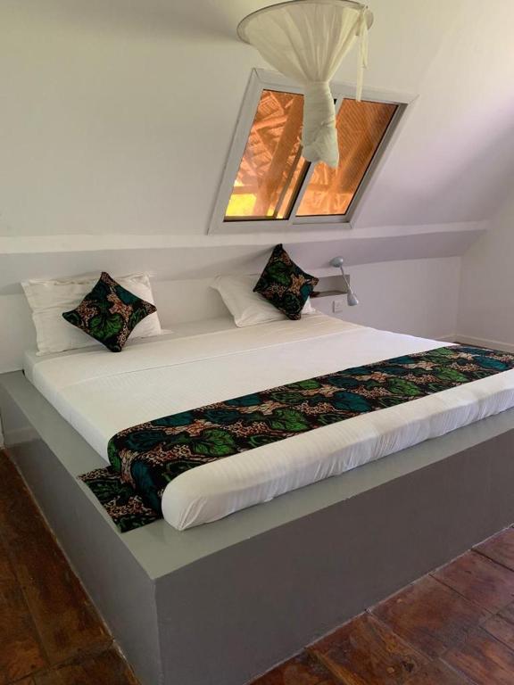 Postel nebo postele na pokoji v ubytování Lazy Beach House