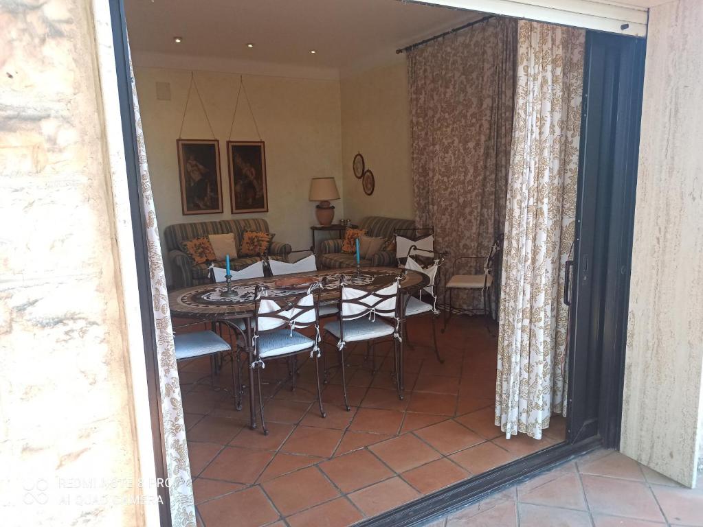 a dining room with a table and chairs at Villa Rossi in Polignano a Mare