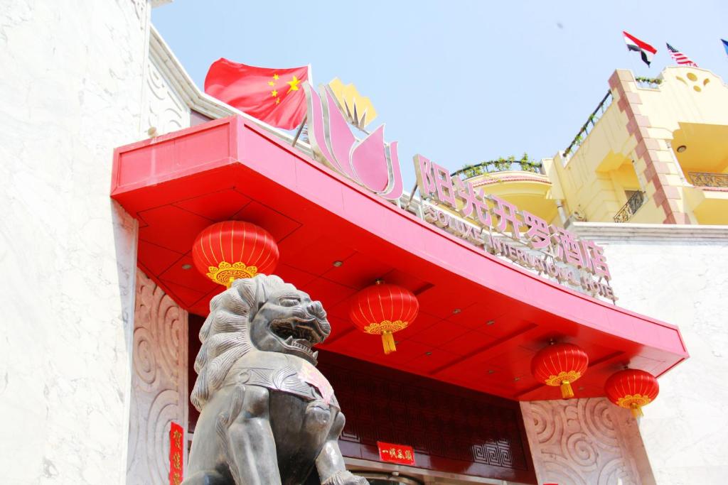 a statue of a lion in front of a building at Soluxe Cairo Hotel in Cairo