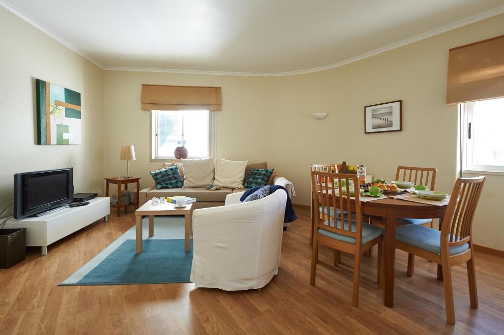 a living room with a couch and a table at Rainha - Holiday Rental in Cascais Centre in Cascais