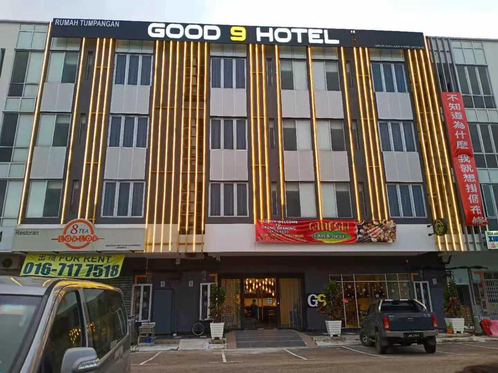 a hotel with gold columns on the front of it at GOOD 9 HOTEL - Cahaya Kota Puteri in Pasir Gudang