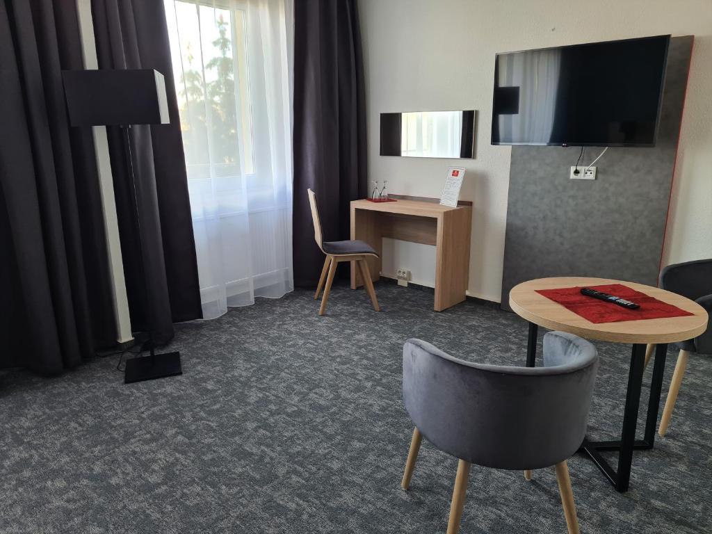 TV a/nebo společenská místnost v ubytování Hanse-Hotel Stendal