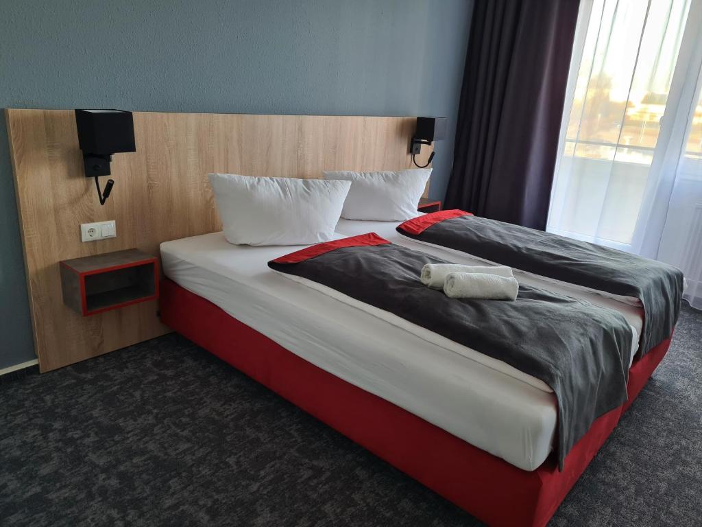 Postel nebo postele na pokoji v ubytování Hanse-Hotel Stendal