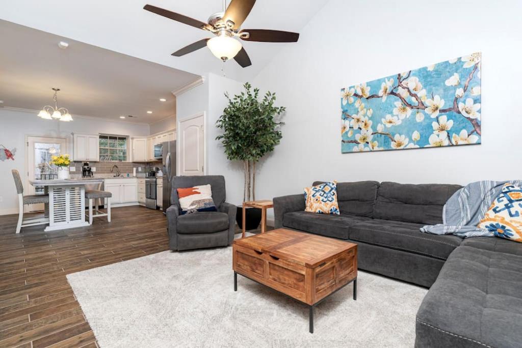 a living room with a couch and a ceiling fan at Elegant Cades Cove Condo with Community Pool in Townsend