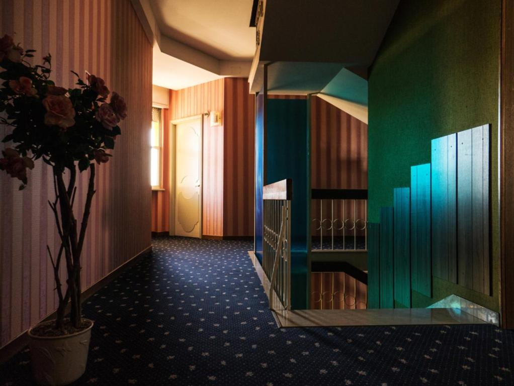 A bed or beds in a room at Hotel Fabius