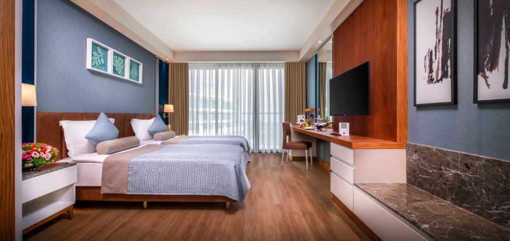 Postel nebo postele na pokoji v ubytování Baia Lara Hotel