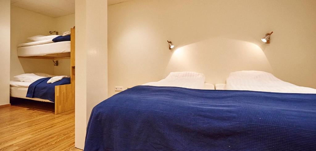 Postel nebo postele na pokoji v ubytování Fridas Hotell