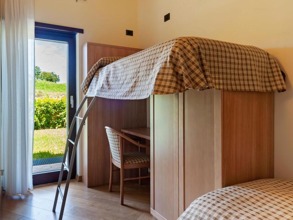 Posteľ alebo postele v izbe v ubytovaní Tassido Coda Resort