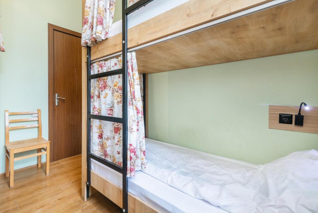 Postel nebo postele na pokoji v ubytování Pushkin 10 Hostel