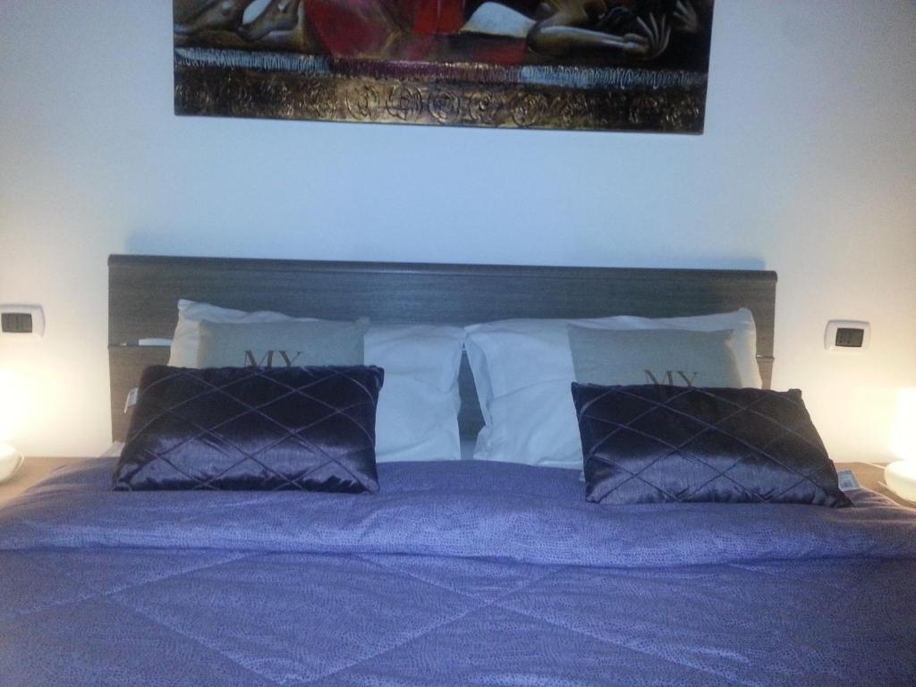 Łóżko lub łóżka w pokoju w obiekcie Appartamento B&B Suite Stefanelli