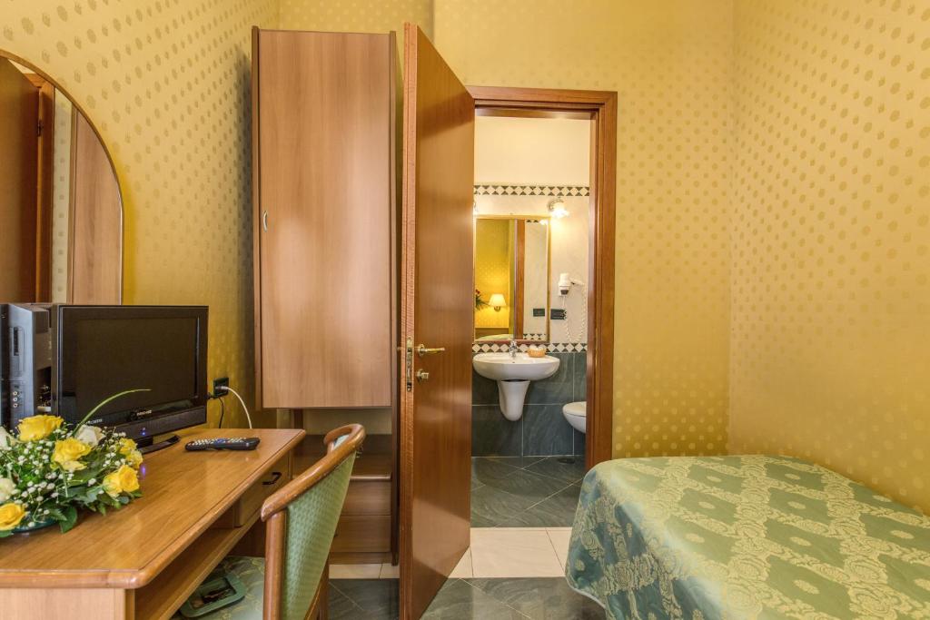 Postel nebo postele na pokoji v ubytování Hotel Contilia
