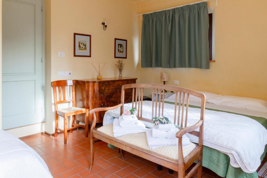 A bed or beds in a room at Rosso Del Chianti