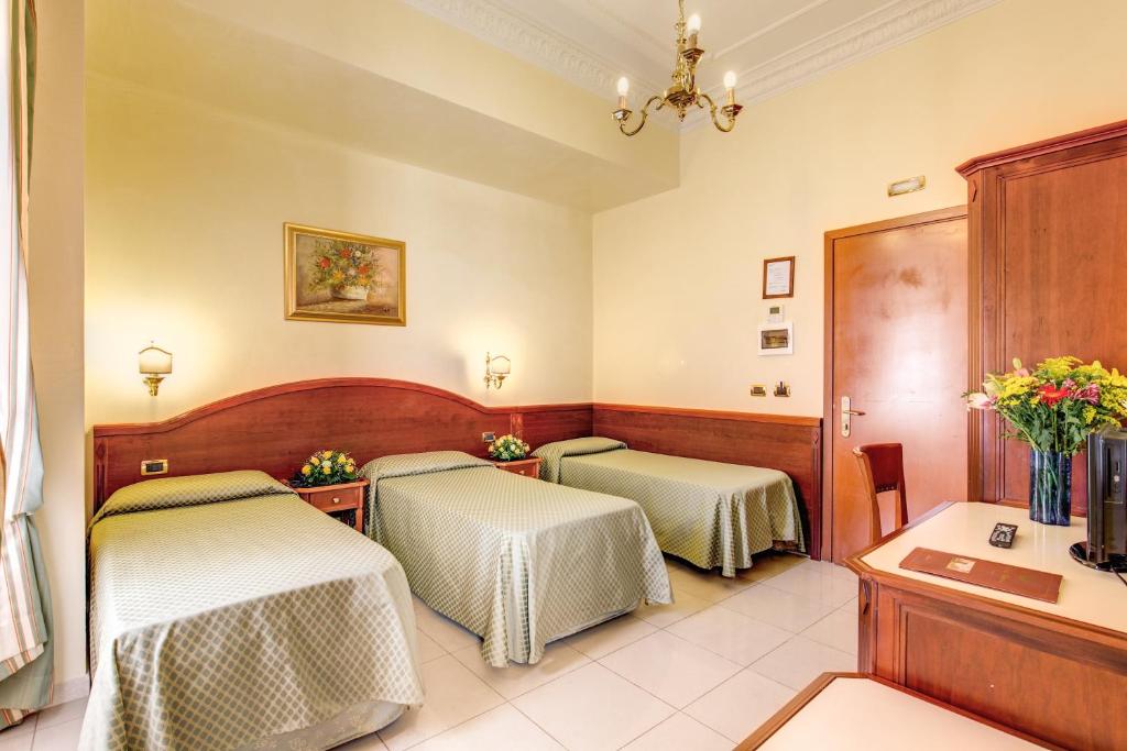 Postel nebo postele na pokoji v ubytování Hotel Contilia