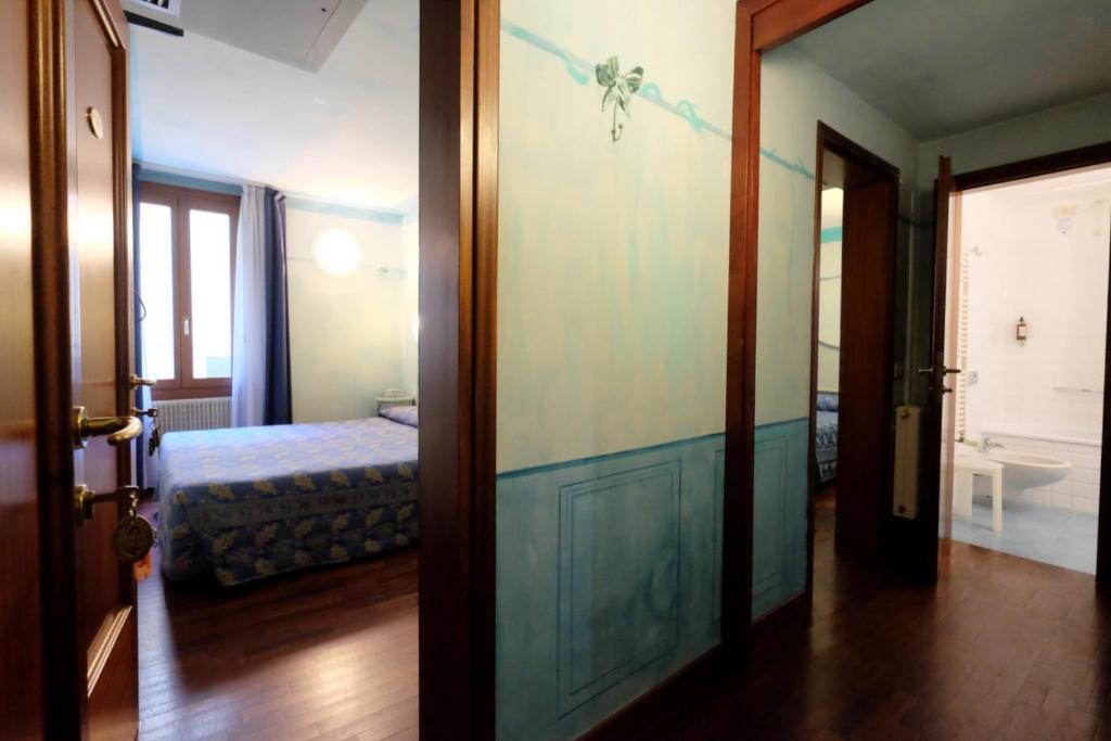 Postel nebo postele na pokoji v ubytování Hotel ai do Mori