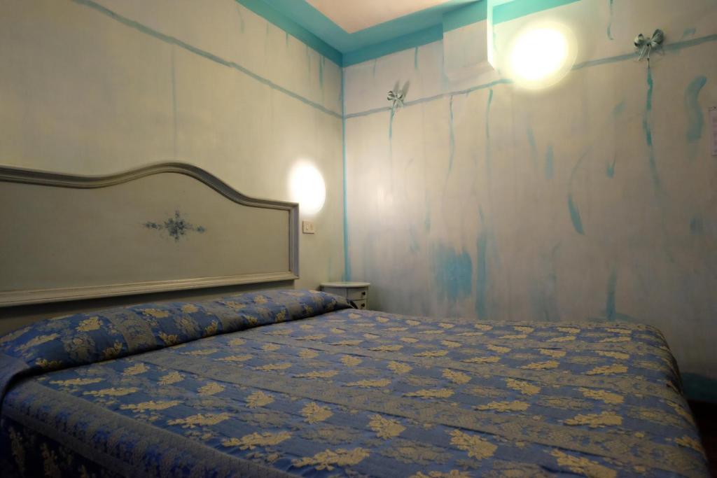 Postel nebo postele na pokoji v ubytování Hotel ai do Mori