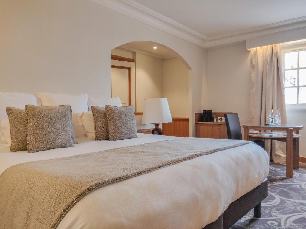 Postel nebo postele na pokoji v ubytování Villa Florentine