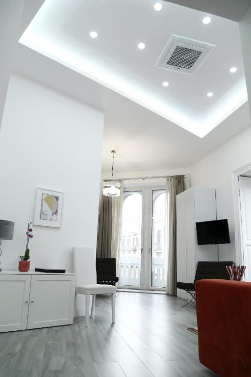 Televízia a/alebo spoločenská miestnosť v ubytovaní Duomo Platinum Apartments