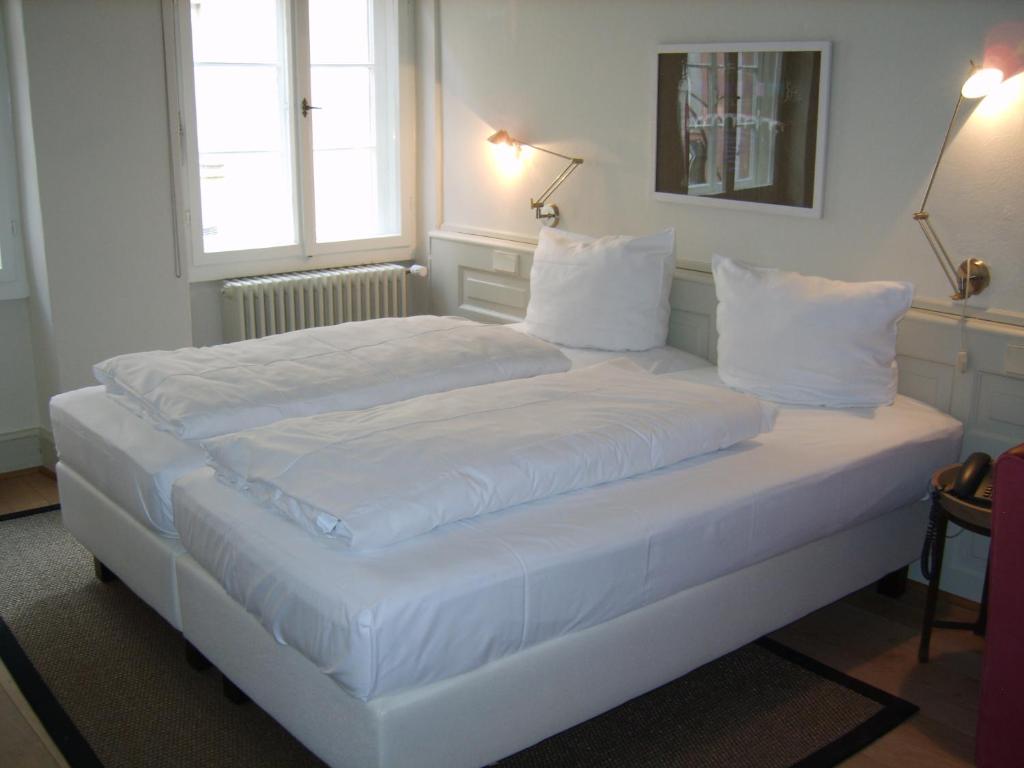 Кровать или кровати в номере Hotel Schnookeloch