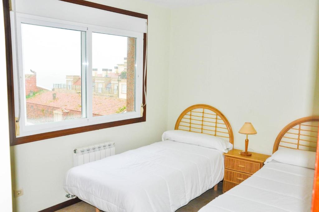 Postel nebo postele na pokoji v ubytování Apartamentos Granxola
