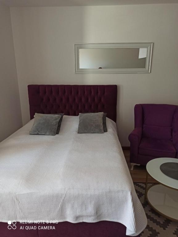 Postel nebo postele na pokoji v ubytování Vlašićka idila apartman Eko Fis 507