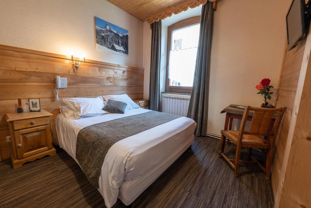 Postel nebo postele na pokoji v ubytování Hotel la Pointe Percee