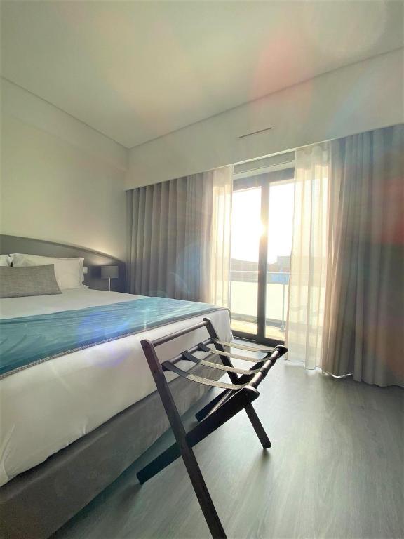 Postel nebo postele na pokoji v ubytování Apulia Praia Hotel