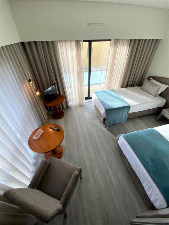 Postel nebo postele na pokoji v ubytování Apulia Praia Hotel
