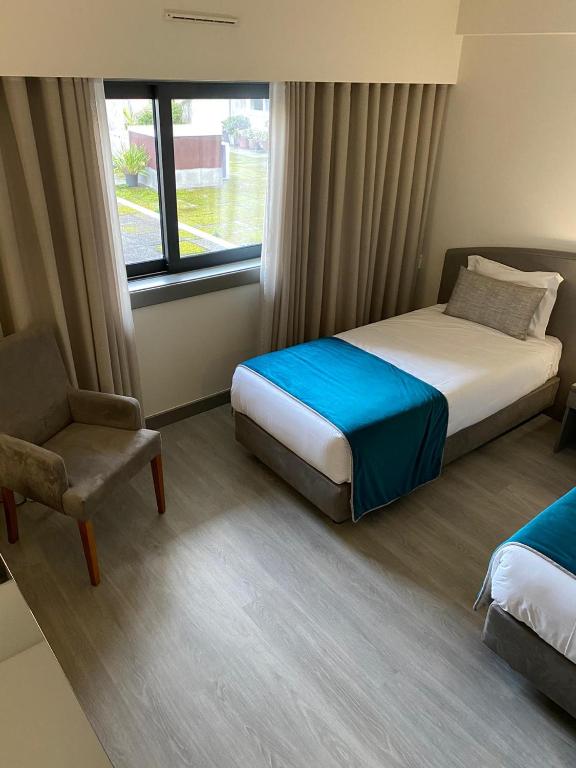 Postel nebo postele na pokoji v ubytování Apulia Praia Hotel