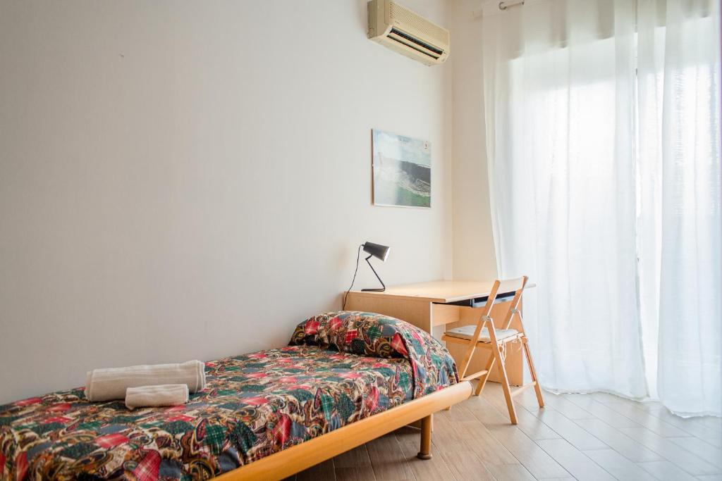 A bed or beds in a room at Appartamenti Parco Archeologico