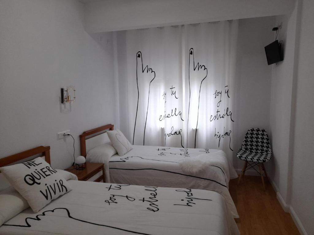 Postel nebo postele na pokoji v ubytování Hostal "Los Chanos el Ruso"