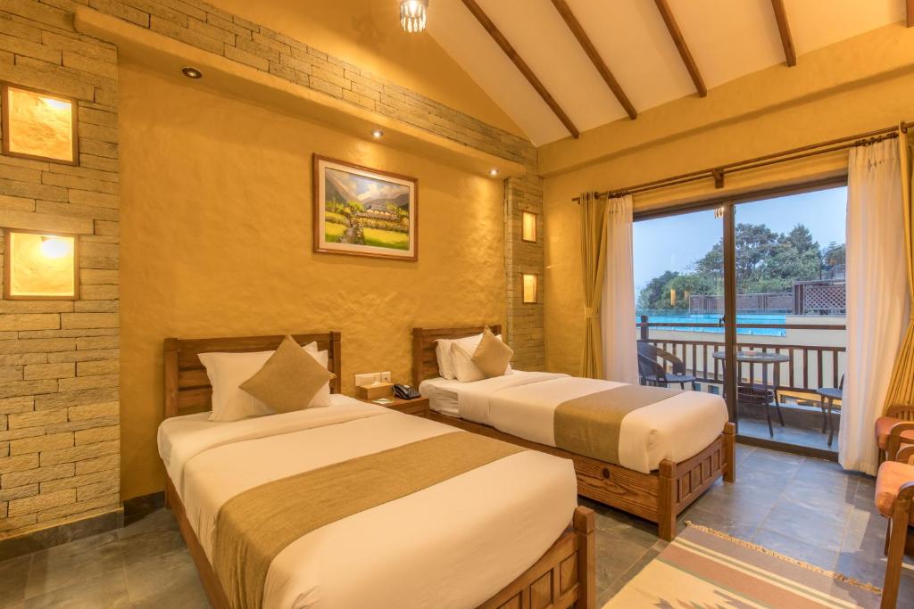 Llit o llits en una habitació de Bar Peepal Resort