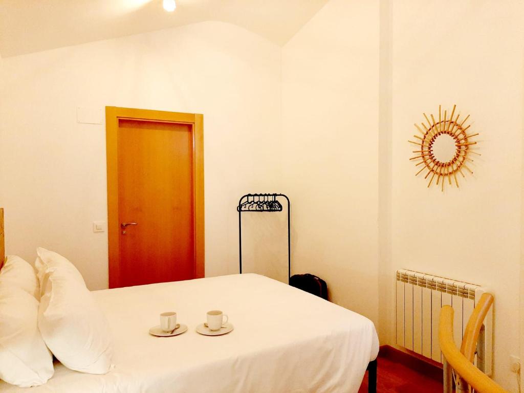 מיטה או מיטות בחדר ב-Apartamentos Candelario by gaiarooms