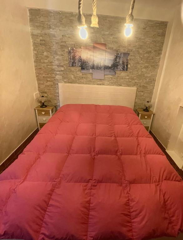 Postel nebo postele na pokoji v ubytování Appartamento in residence Ovindoli
