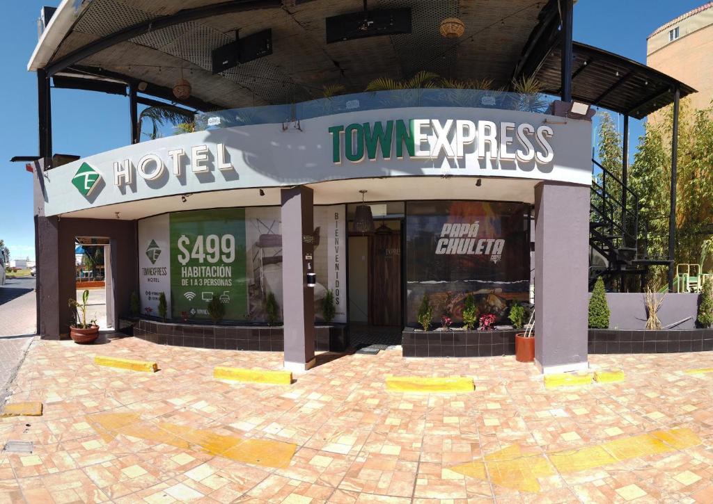 a store front with a sign for a tummy express at Hotel Town Express in Durango