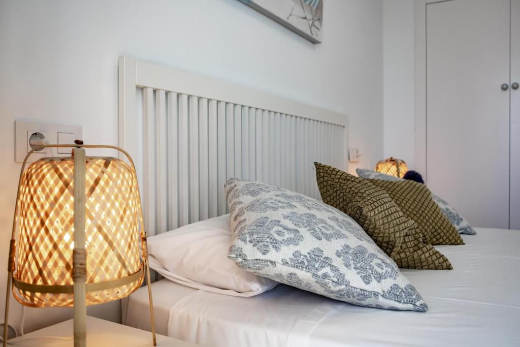 A bed or beds in a room at Villas Guzman - Molinet