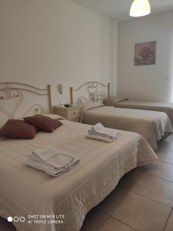 Postel nebo postele na pokoji v ubytování Villa Lorenza