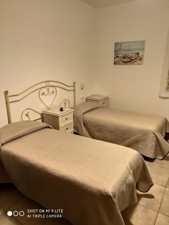 Postel nebo postele na pokoji v ubytování Villa Lorenza