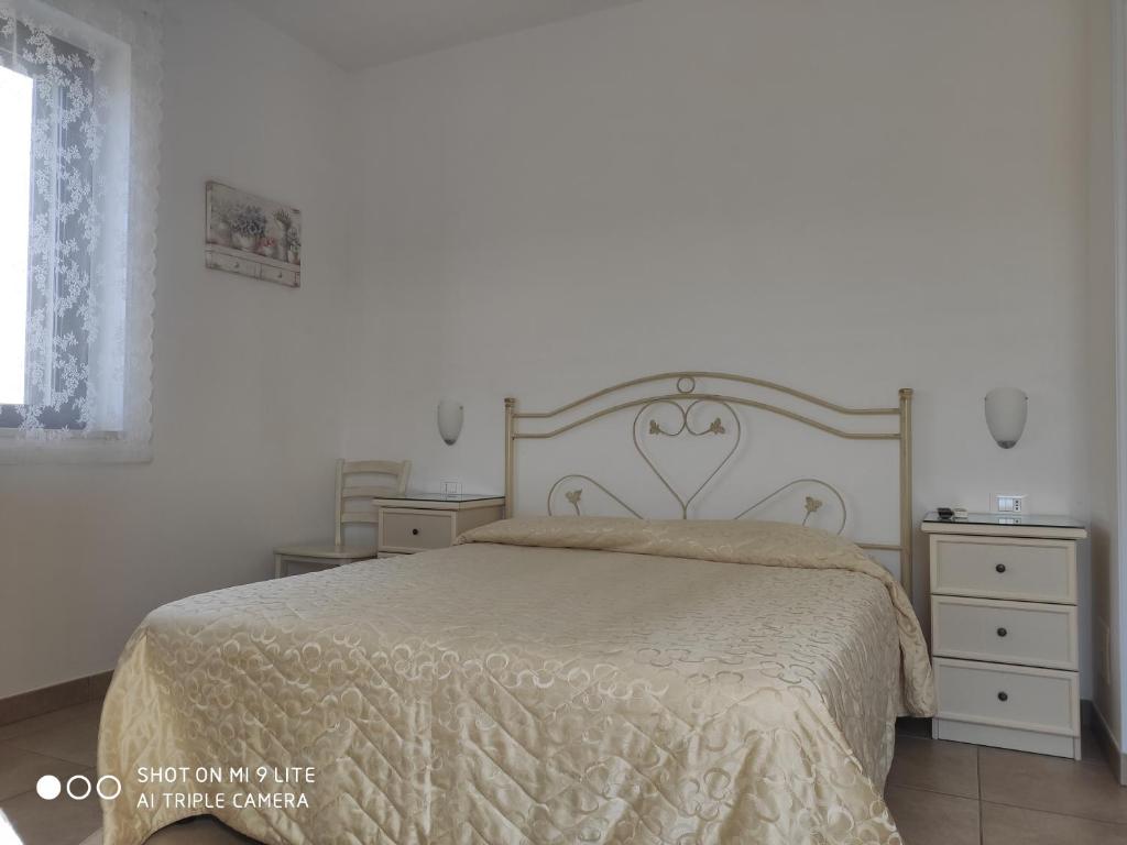 Postel nebo postele na pokoji v ubytování Villa Lorenza
