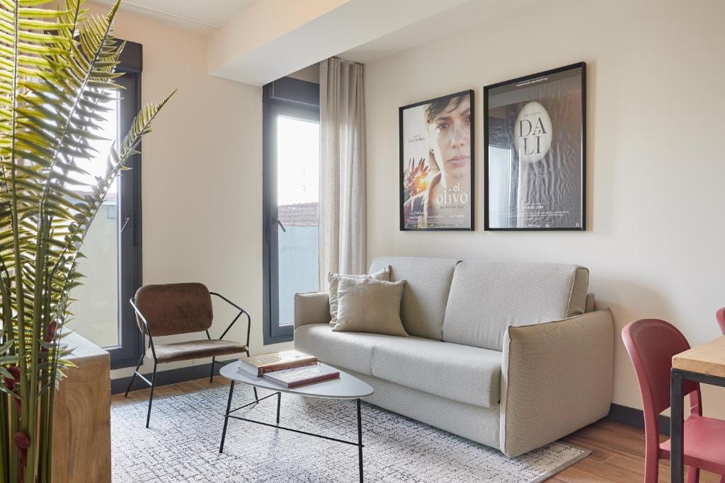 a living room with a couch and a chair at Sonder Malasaña in Madrid