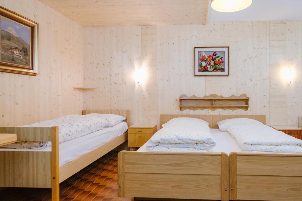 Postel nebo postele na pokoji v ubytování Garni Fany