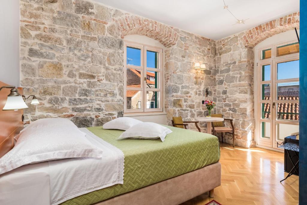 Posteľ alebo postele v izbe v ubytovaní Captain's Guest House