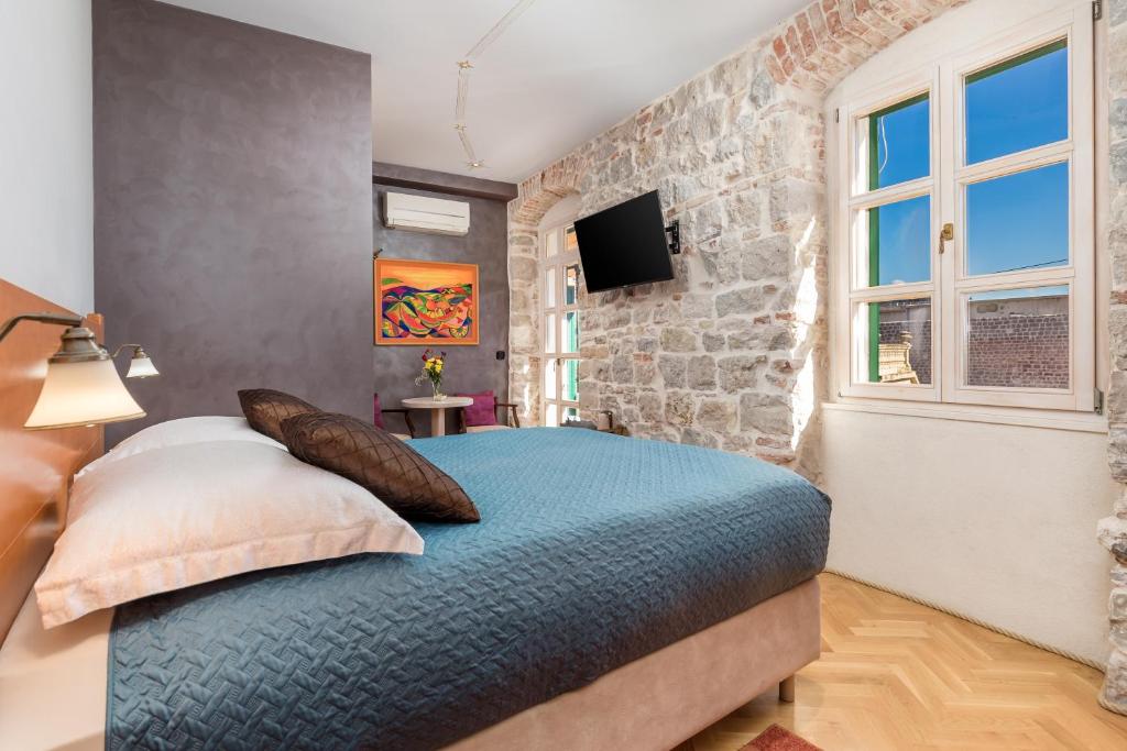 Posteľ alebo postele v izbe v ubytovaní Captain's Guest House