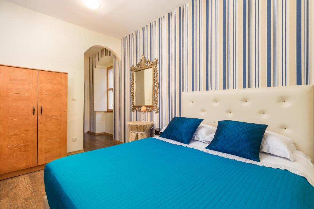 Posteľ alebo postele v izbe v ubytovaní Captain's Guest House