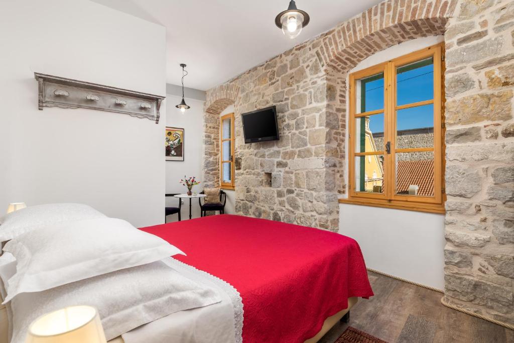 Posteľ alebo postele v izbe v ubytovaní Captain's Guest House