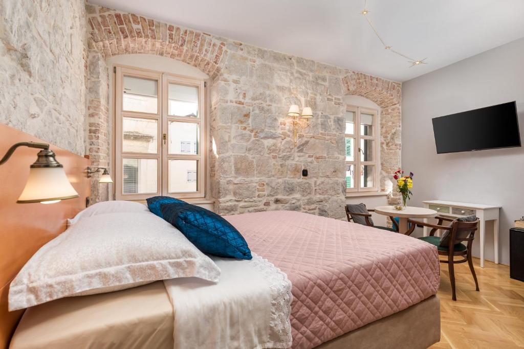 Posteľ alebo postele v izbe v ubytovaní Captain's Guest House