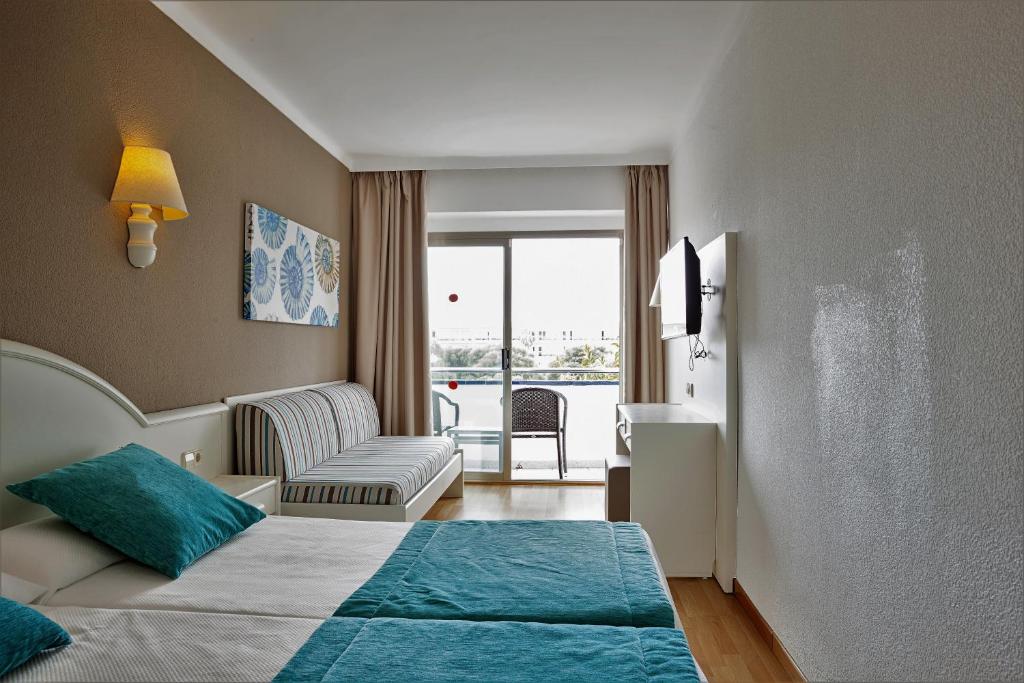 Posteľ alebo postele v izbe v ubytovaní Hotel Mariant