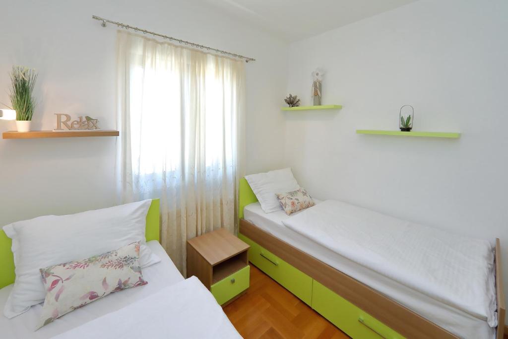 Postel nebo postele na pokoji v ubytování Villa Topesa 1