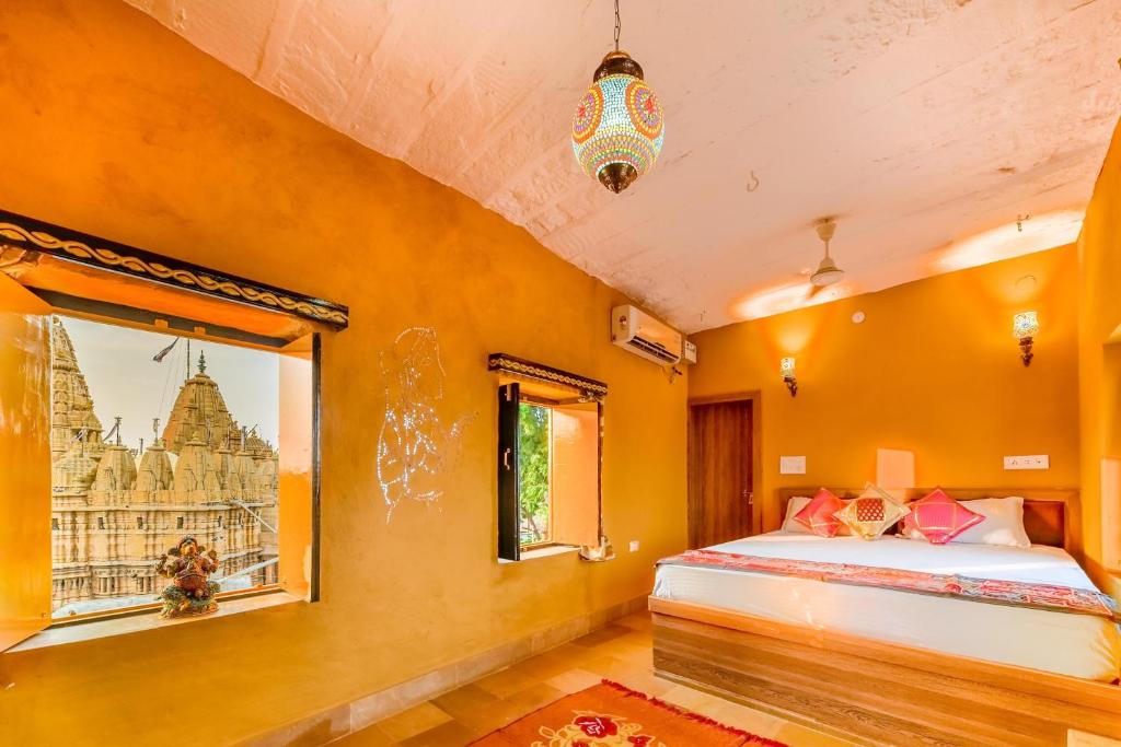 Postel nebo postele na pokoji v ubytování Mud Mirror Guesthouse