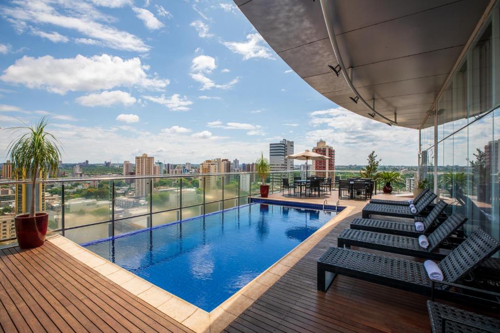 a swimming pool on top of a building at Viale Tower Hotel in Foz do Iguaçu